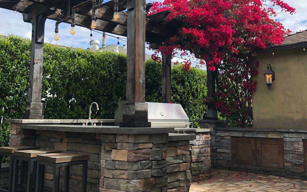 Olmos landscape bbq islands with stone and paver patio