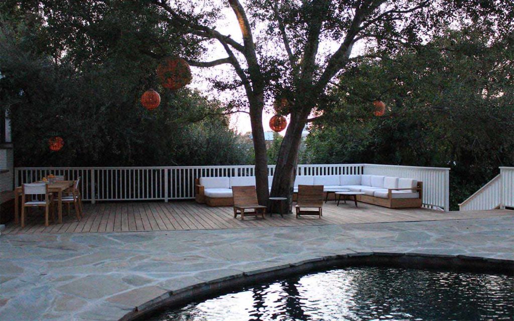 Olmos patios with flagstone pool decking and wood deck